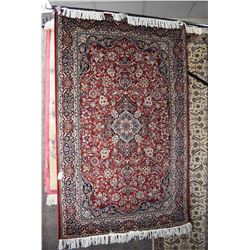 Fine wool blend area carpet with center medallion, overall floral design in shades or red, green, cr