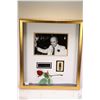 Image 1 : Gilt framed black and white photograph of Prime Minister Pierre Elliot Trudeau with rose and pin, pe