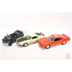 Three 1:18 scale vehicles including 1969 Pontiac GTO Judge, 1969 Ford Mustang and a Kubelwagen milit