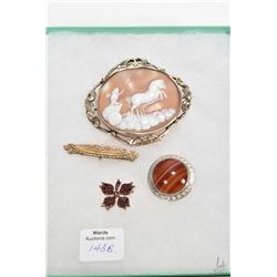 four antique brooches including rolled gold carved cameo, embossed gold bar, Bohemian garnet set bro