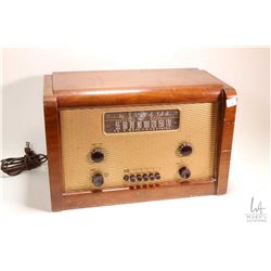 Wood cased table top Marconi Model 238 radio, working at time of cataloguing. Note: No Shipping. Loc