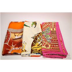 Three large Hermes silk scarves with hand rolled and hand stitched edges-note assume not authentic