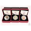 Image 1 : Three Royal Canadian Mint cased coloured coins including 2012 Rose-breasted Grosbeak 25 cent coin, 2