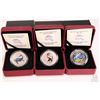 Image 1 : Three cased Royal Canadian Mint including two 25 cent 2013 coloured coins from the Prehistoric Creat