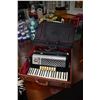 Image 1 : Black, cream and silver Scandalli accordion with hard and soft cases