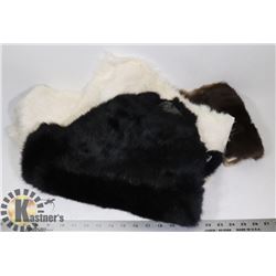1 LARGE BLACK RABBIT PELT AND 4 SMALL PELTS