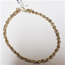 34) 18KT YELLOW AND WHITE GOLD DIAMOND BRACELET