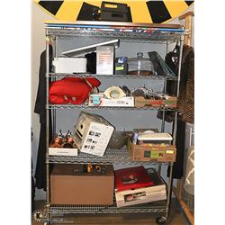 RACK OF UNCLAIMED MERCHANDISE *STOLLERY DONATION