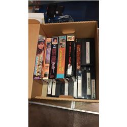 Box of vintage adult entertainment VHS tapes