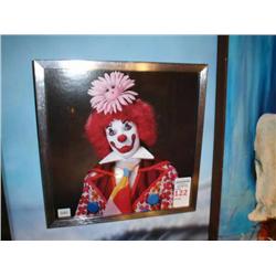 Clown with daisy in metal frame