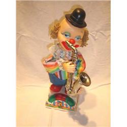 Saxaphone playing clown-Plays 3 blind m