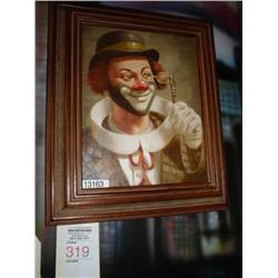framed clown looking through spectacles