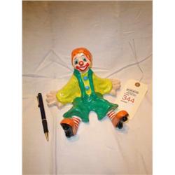 Small paper mache clown sitting