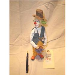 clown with purpole umbrella figurine