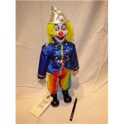 silver hat clown doll on stand