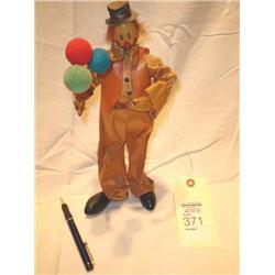 brown pape clown doll with balloons