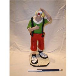 Ceramic clown holding stomach