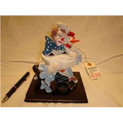 Clown with goose ceramic figurine