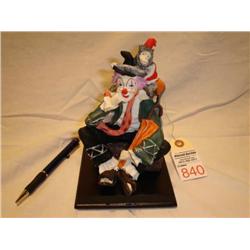 clown with monkey ceramic figurine