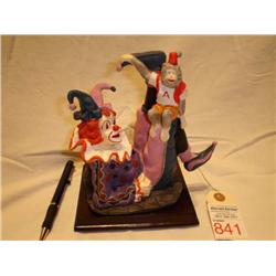 Jester clown with monkey figurine