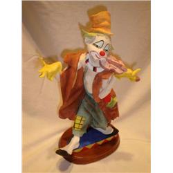 Ceramic clown with violin figurine