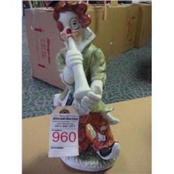 Ceramic clown with horn figurine