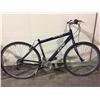 Image 2 : 2 BIKES - SILVER NORCO 18-SPEED FRONT SUSPENSION CRUISER BIKE, DARK BLUE CCM 21-SPEED HYBRID BIKE