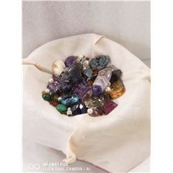 SMALL DISH CONTAINING VARIOUS GEMS TAKEN FROM