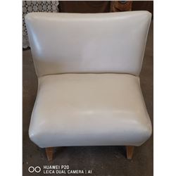 MID CENTURY MODERN CREAM LEATHER CHAIR 34" X 31"