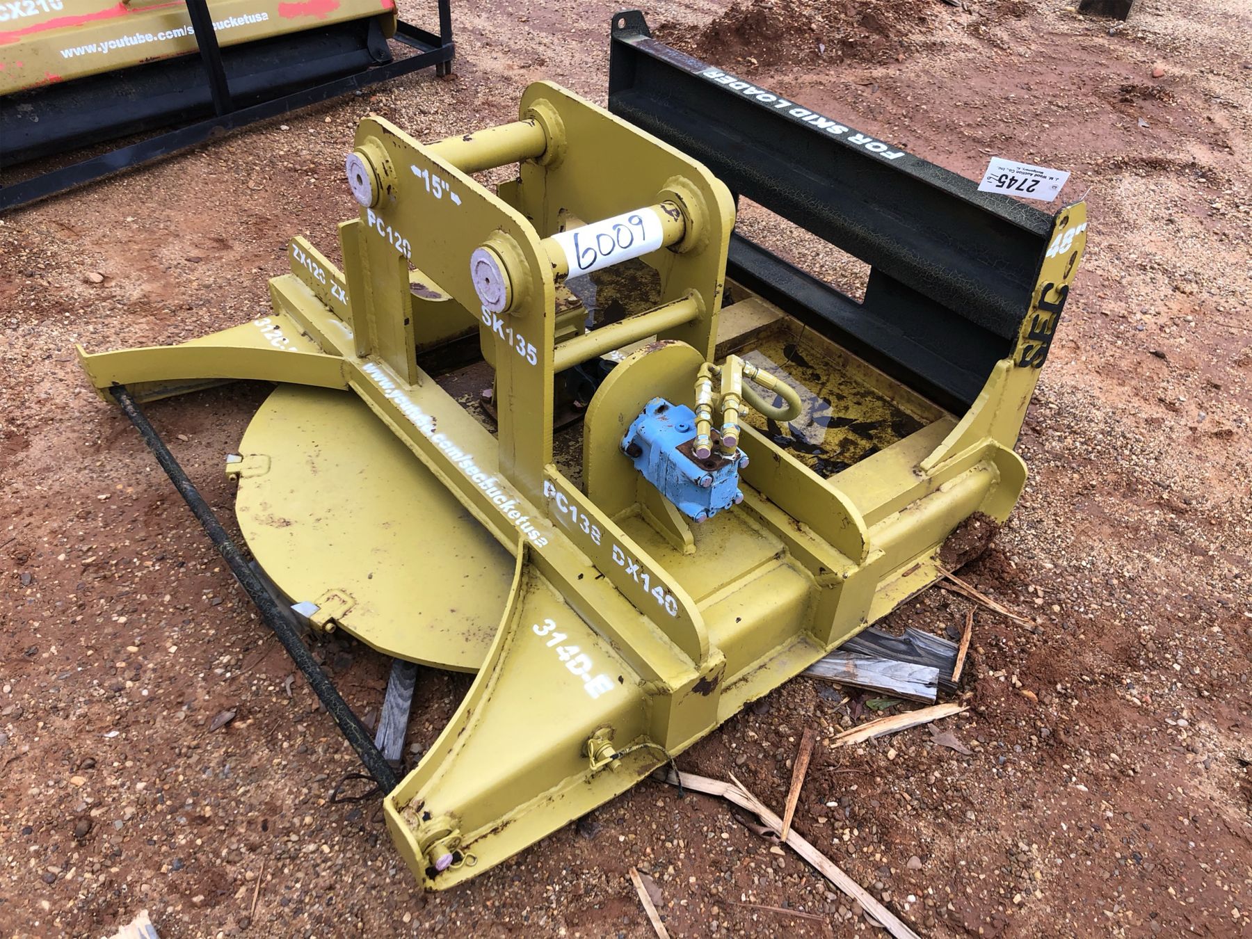 Excavator Attachment J.M. Wood Auction Company, Inc.