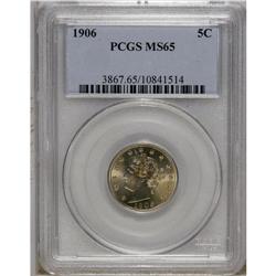 1906 5C MS65 PCGS. Pale orange and pink patina drapes 