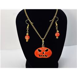 27)  GOLD TONE WITH ORANGE ENAMEL