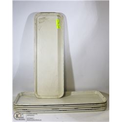 STACK OF SLENDER RESTAURANT TRAYS