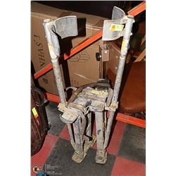 SET OF DRYWALL STILTS.