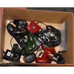 BOX OF ASSORTED GAME CONTROLLERS AND MORE.