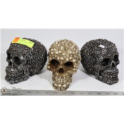 LOT OF 3 DECORATIVE SKULL DECORATIONS.