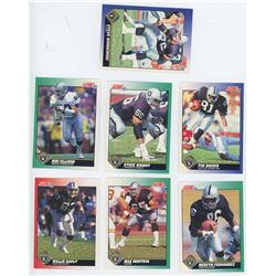 Lot of 7 Oakland Raiders NFL cards. Includes Mervyn Fernandez, Tim Brown, & Max Montoya. All Unc.