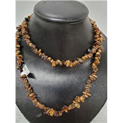 36 INCH STRAND OF TIGERS EYE BEADS.