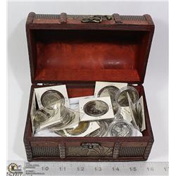 TREASURE CHEST OF TOKENS AND TRADE DOLLARS.