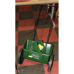 SCOTTS AUTO GREEN PUSH SPREADER WITH HAND
