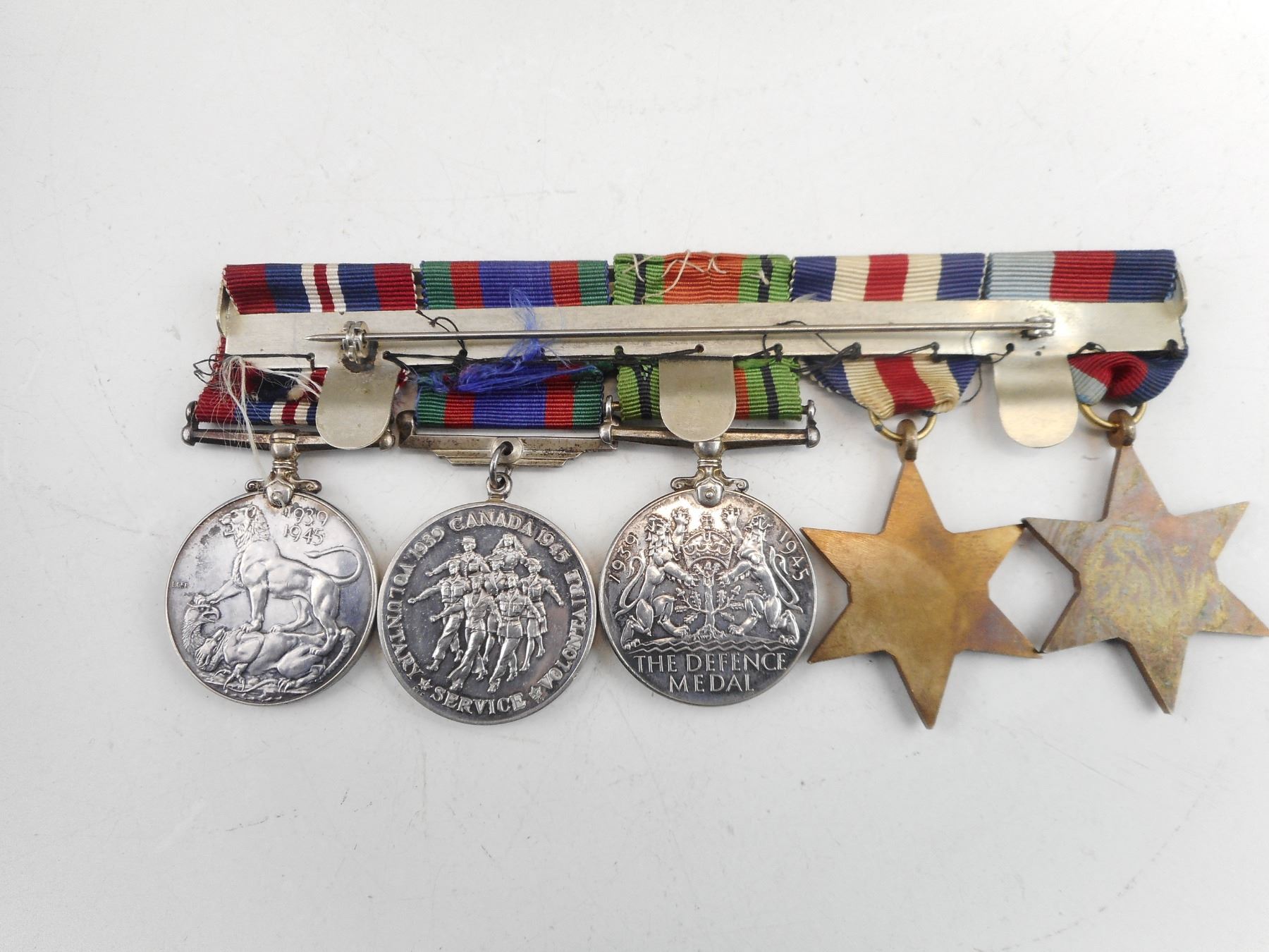 CANADIAN WWII MEDALS WITH RIBBONS ON BAR