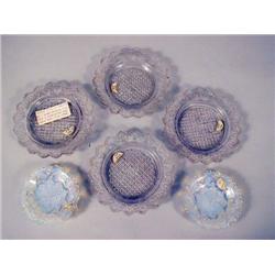 A GROUP OF FOUR SANDWICH GLASS PLATES