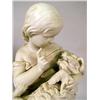Image 3 : A PARIANWARE FIGURE OF A GIRL HOLDING A