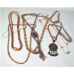 A GROUP OF GOLD TONE CHAINS