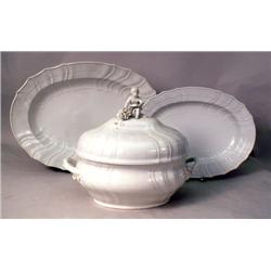 AN OVAL HANDLED PORCELAIN COVERED TUREE