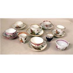 A GROUP OF GERMAN PORCELAIN CUPS AND SA