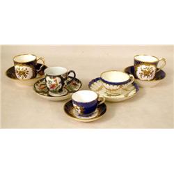 A GROUP OF FIVE PORCELAIN CUPS AND SAUC