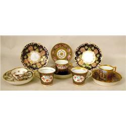AN ASSEMBLED GROUP OF PORCELAIN CUPS AN