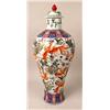 Image 1 : A POLYCHROME FLORAL AND FISH DECORATED 