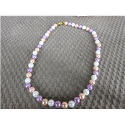 Colored Pearl Necklace Knotted between each Pearl